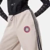 Kombinéza Adidas X Moon Boot v krémové barvě Kombinéza Adidas X Moon Boot v krémové barvě